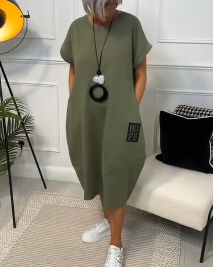 Paige | Effortless Short Sleeve Black Midi Dress With Pockets