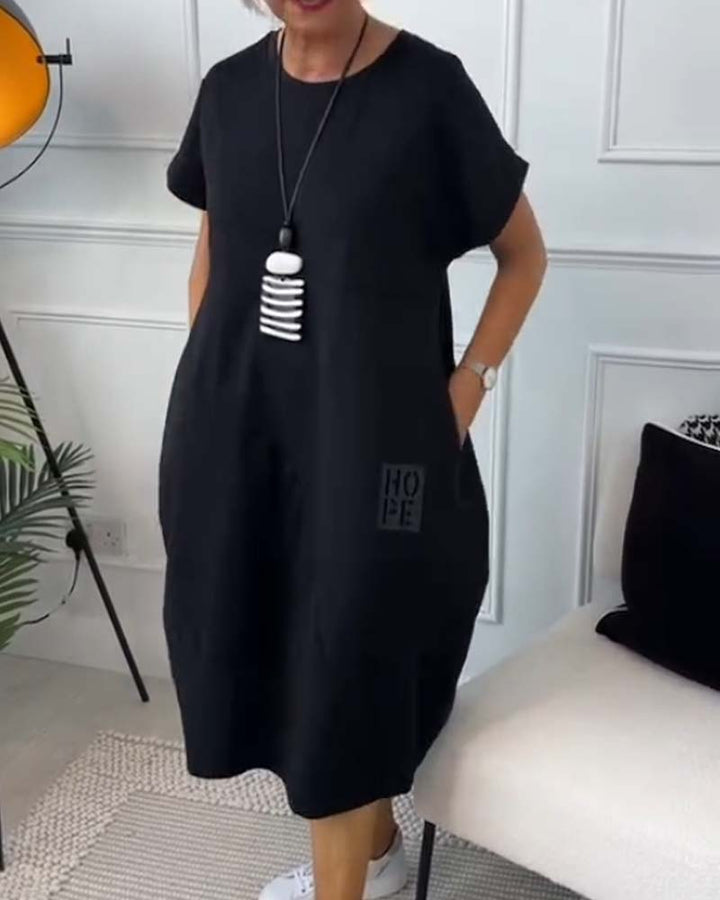 Paige | Effortless Short Sleeve Black Midi Dress With Pockets