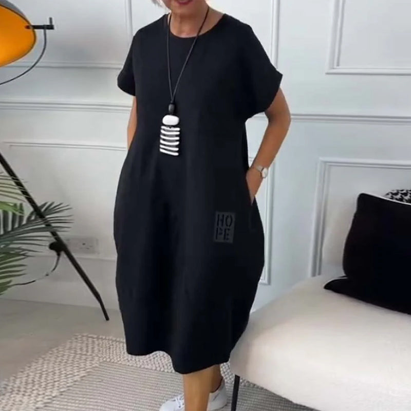 Paige | Effortless Short Sleeve Black Midi Dress With Pockets