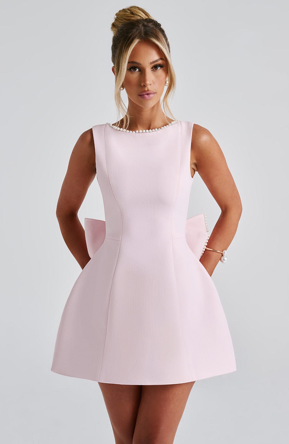 Sybil | Elegant Sleeveless A-Line Mini Dress With Bow Back Detail