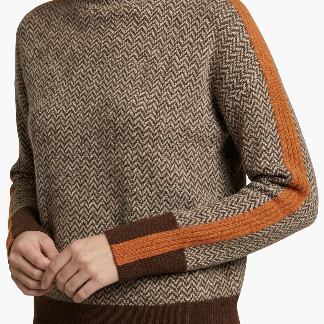 Penelope | Elegant Chevron Turtleneck Sweater With Orange Accents