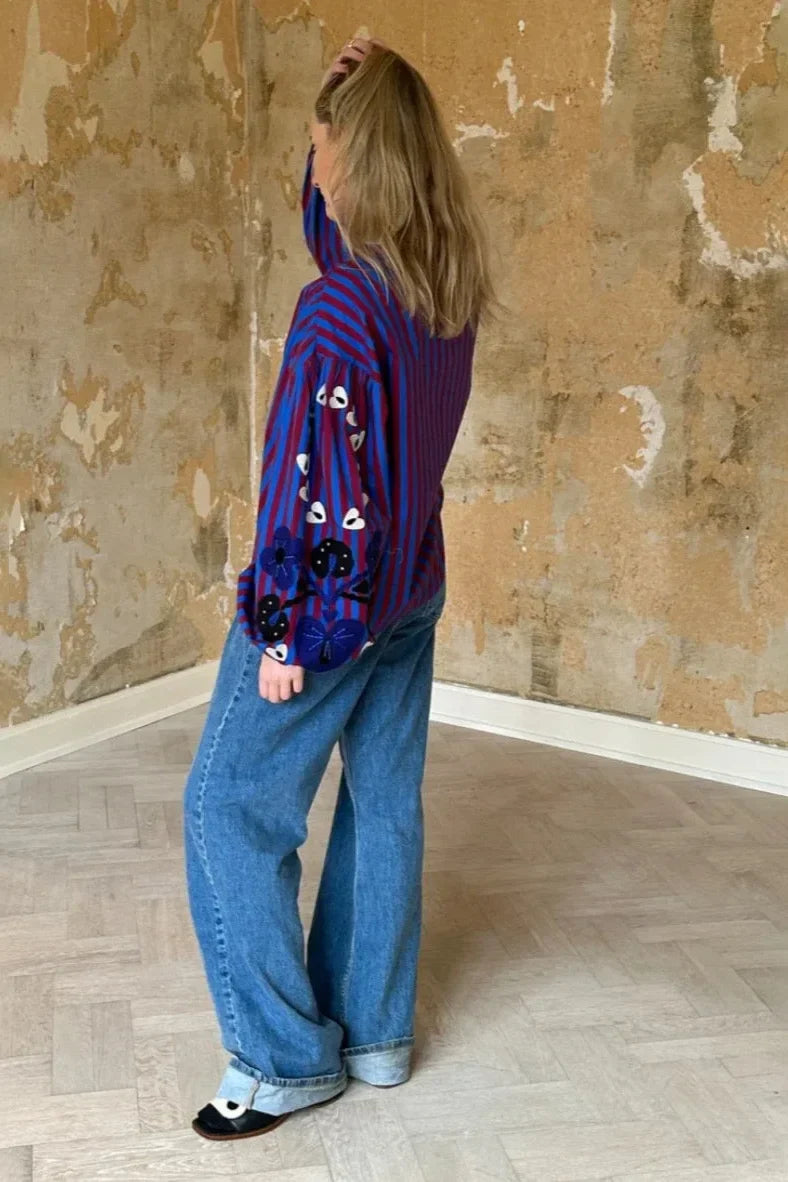 Theodora | Chic Striped Ruffle Blouse With Embroidered Sleeves