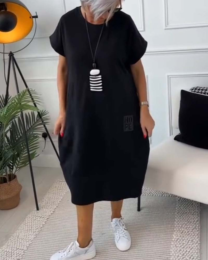 Paige | Effortless Short Sleeve Black Midi Dress With Pockets