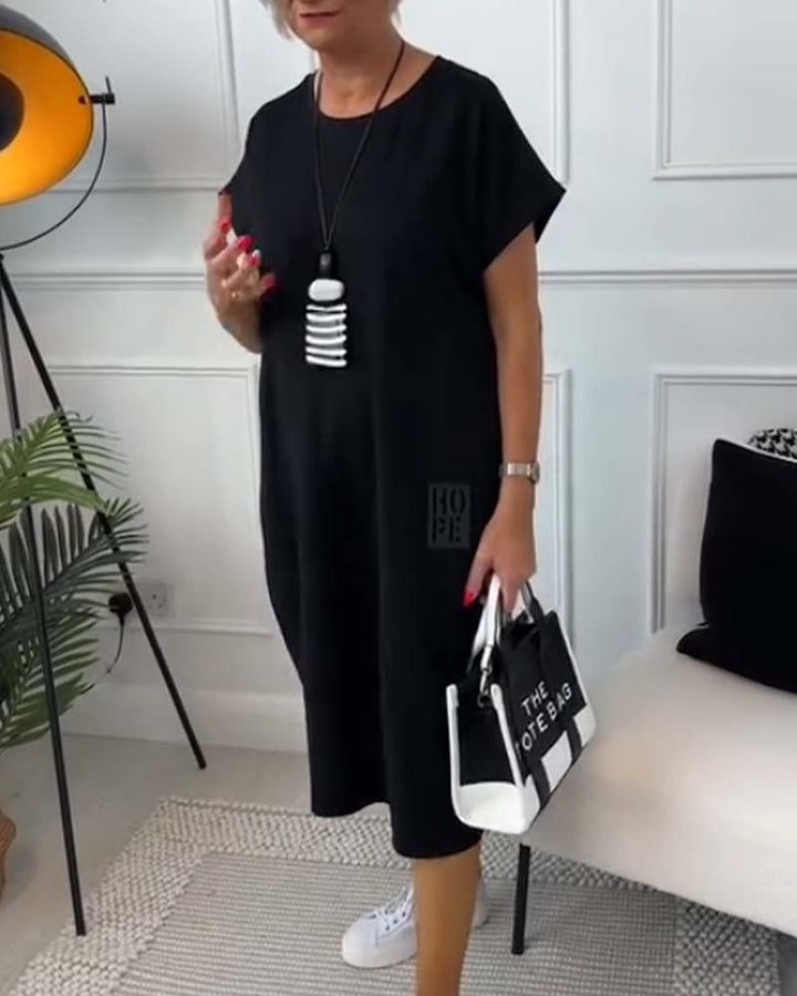 Paige | Effortless Short Sleeve Black Midi Dress With Pockets